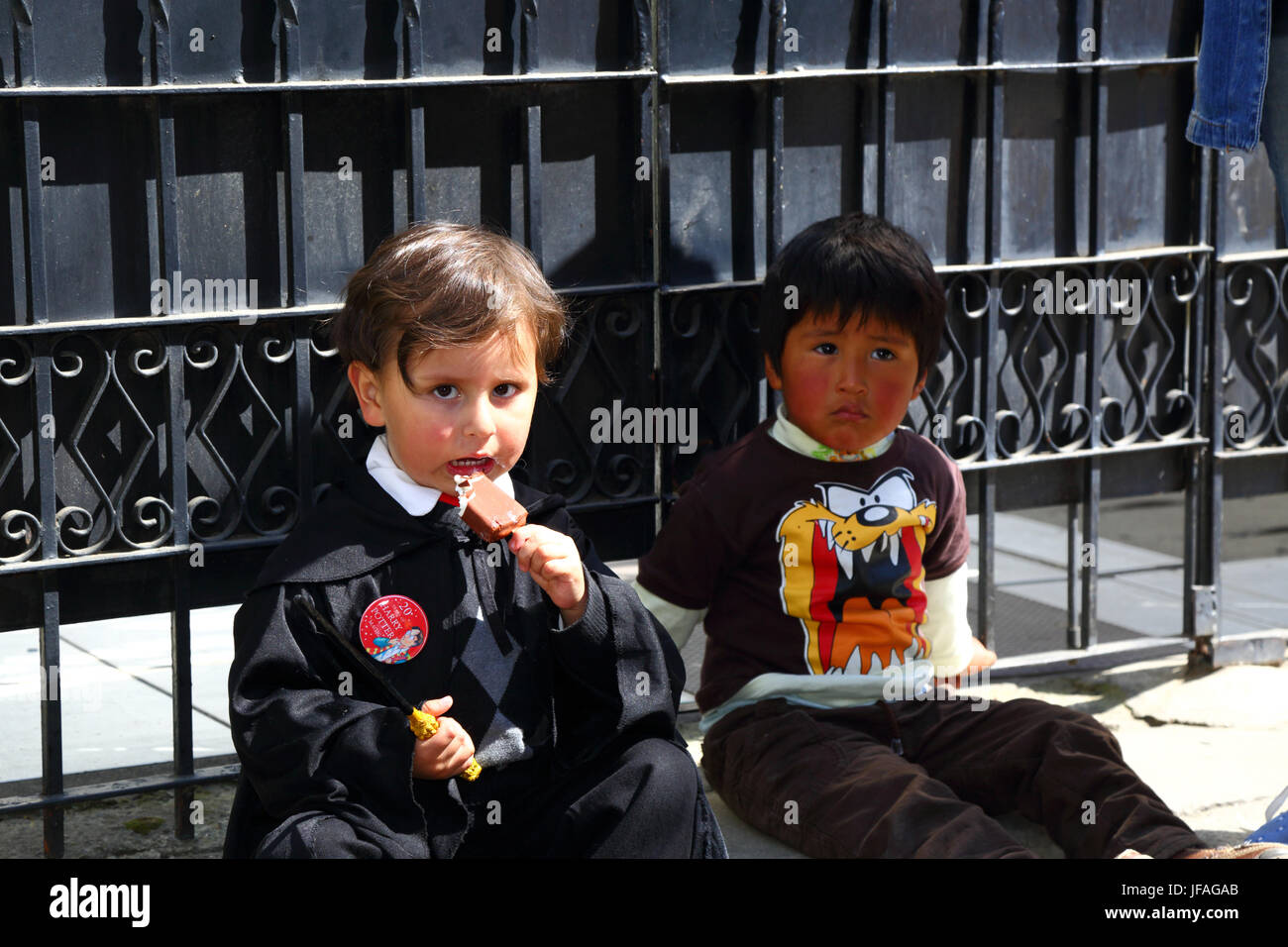 La Paz, Bolivia, 30th June 2017. A young boy dressed as a magician enjoys an ice cream at an event organised by the UK Embassy to celebrate the 20th Anniversary of publication of first Harry Potter book, Harry Potter and the Philosopher's Stone by J.K. Rowling, which was published this week in 1997. Credit: James Brunker/Alamy Live News Stock Photo