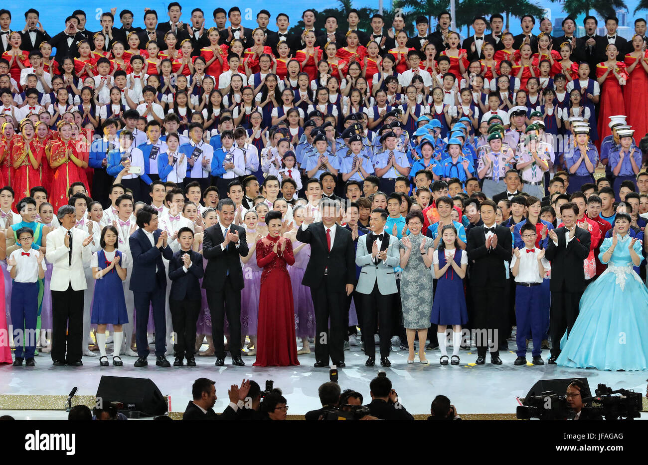 (170630) -- HONG KONG, June 30, 2017 (Xinhua) -- Chinese President Xi Jinping (C, front), also general secretary of the Central Committee of the Communist Party of China and chairman of the Central Military Commission, steps onto the stage and sings in chorus the song 'Ode to the Motherland' with the performers and the audience during a grand gala marking the 20th anniversary of Hong Kong's return to China at Hong Kong Convention and Exhibition Center, in Hong Kong, south China, June 30, 2017. (Xinhua/Ma Zhancheng) (ly) Stock Photo