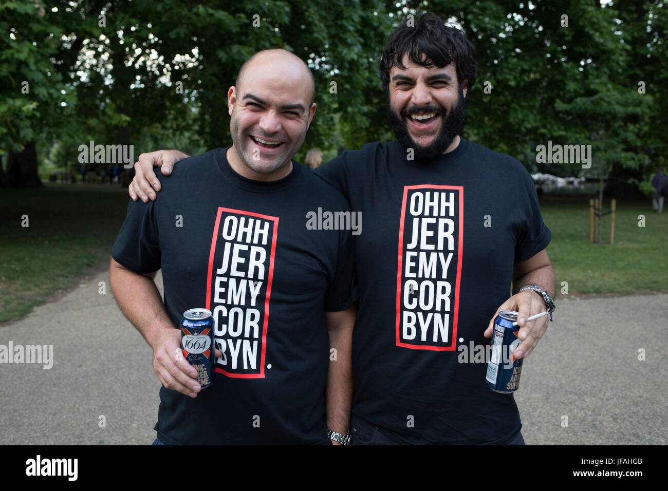 London, UK. 30th June, 2017. Jeremy Corbyn t-shirts sported by two friends at Theresa May's Leaving Drinks in St James's Park in London, England, United Kingdom. Following the General Election, there has been a great deal of dismay concerning the legitimacy of the Conservative government and Conservative plans for Brexit, and this has sparked events, which although a satirical leaving party, also a political statement of discontent. A precursor to larger demonstration in London the following day Credit: Michael Kemp/Alamy Live News Stock Photo