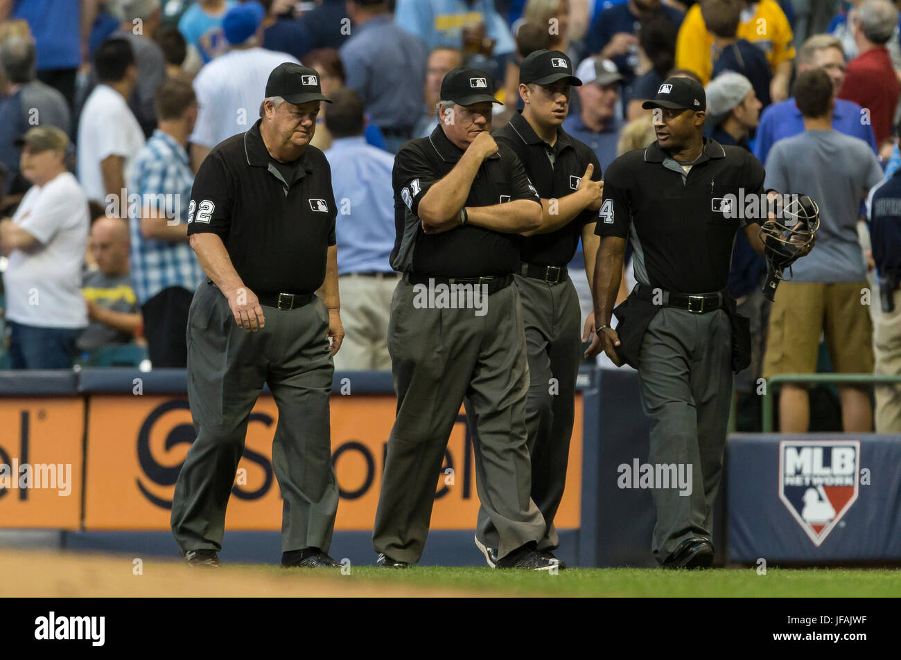 Milwaukee, WI, USA. 30th June, 2017. First base umpire Joe West #22 was hit in the head with a baseball thrown from the crowd in the Major League Baseball game between the Milwaukee Brewers and the Miami Marlins at Miller Park in Milwaukee, WI. John Fisher/CSM/Alamy Live News Stock Photo