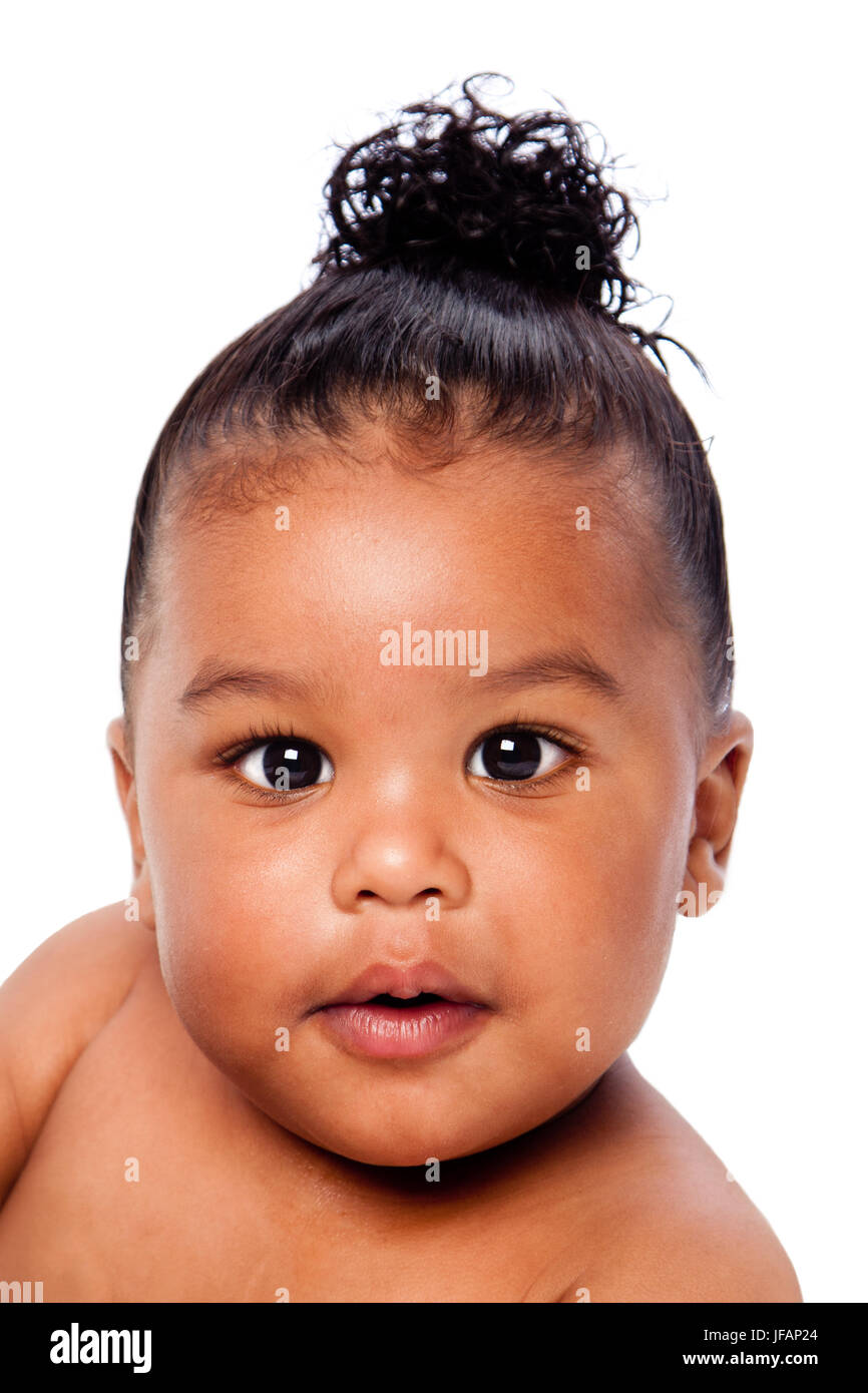 Face of beautiful cute baby toddler with hair in bun. Stock Photo