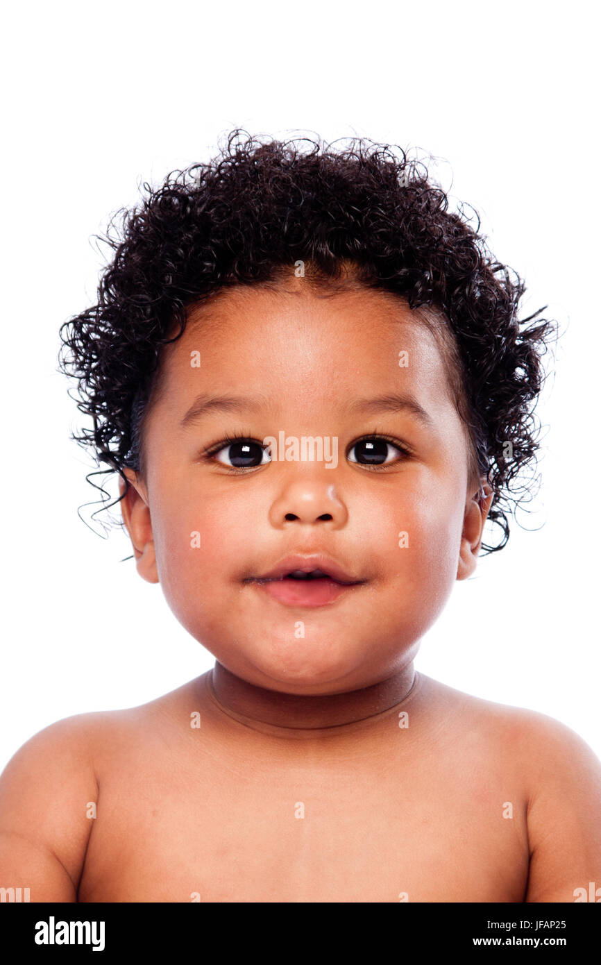 Face of beautiful cute baby toddler with curly hair. Stock Photo