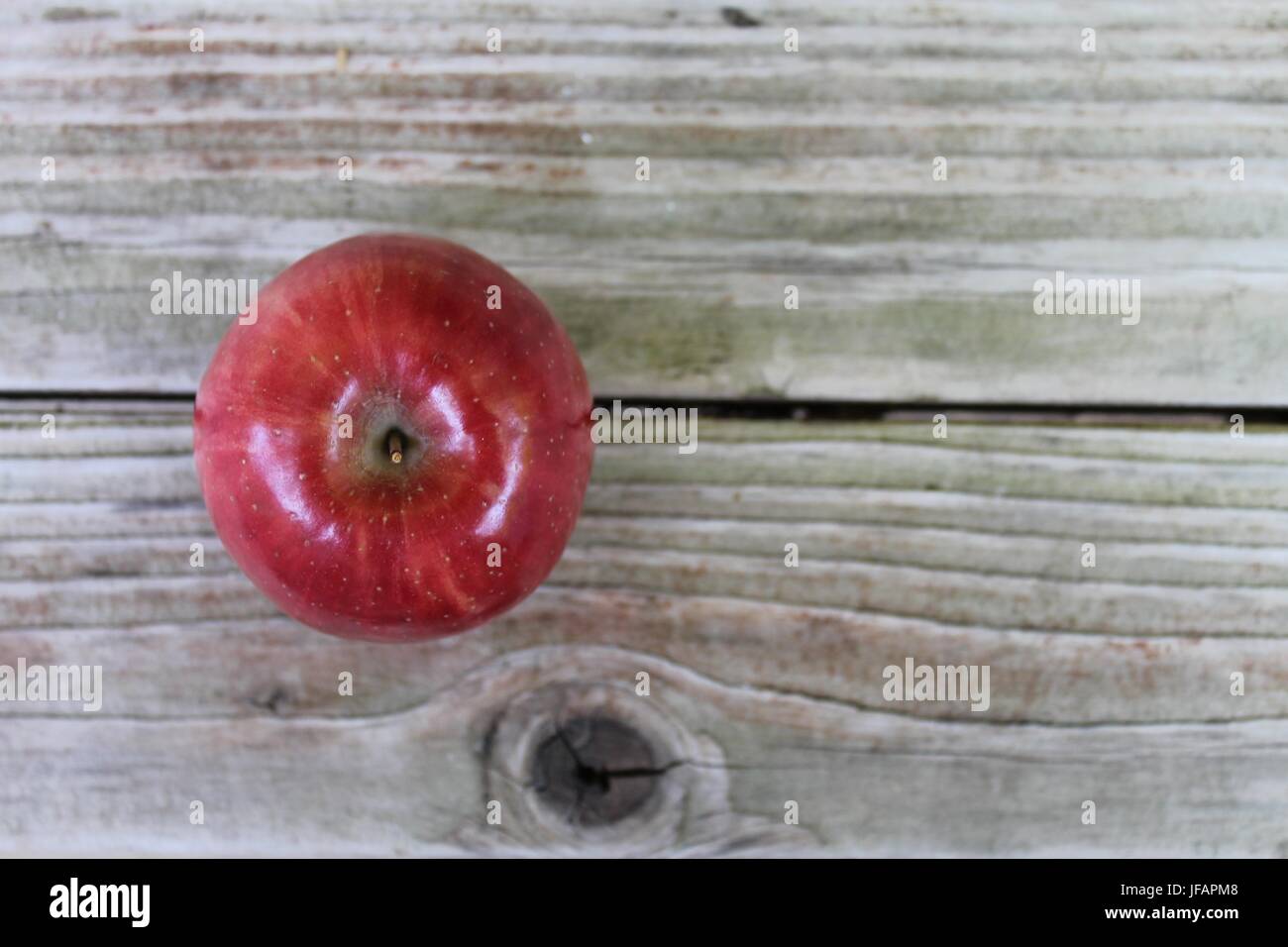 red apple on wooden table Stock Photo