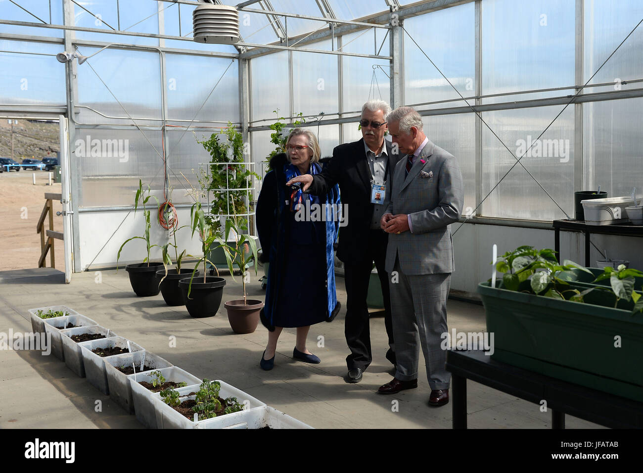 The Prince of Wales is given a tour of a greenhouse at the Nunavut Research Institute, Iqaluit, the capital city of the Canadian territory of Nunavut, at the start of his visit to Canada with the Duchess of Cornwall. Stock Photo