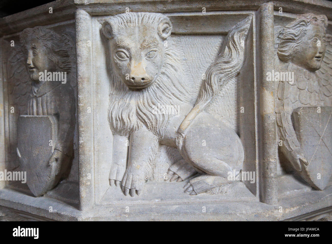 Carved stone lion and angels baptismal font, Church of Saint Gregory, Rendlesham, Suffolk, England, UK Stock Photo