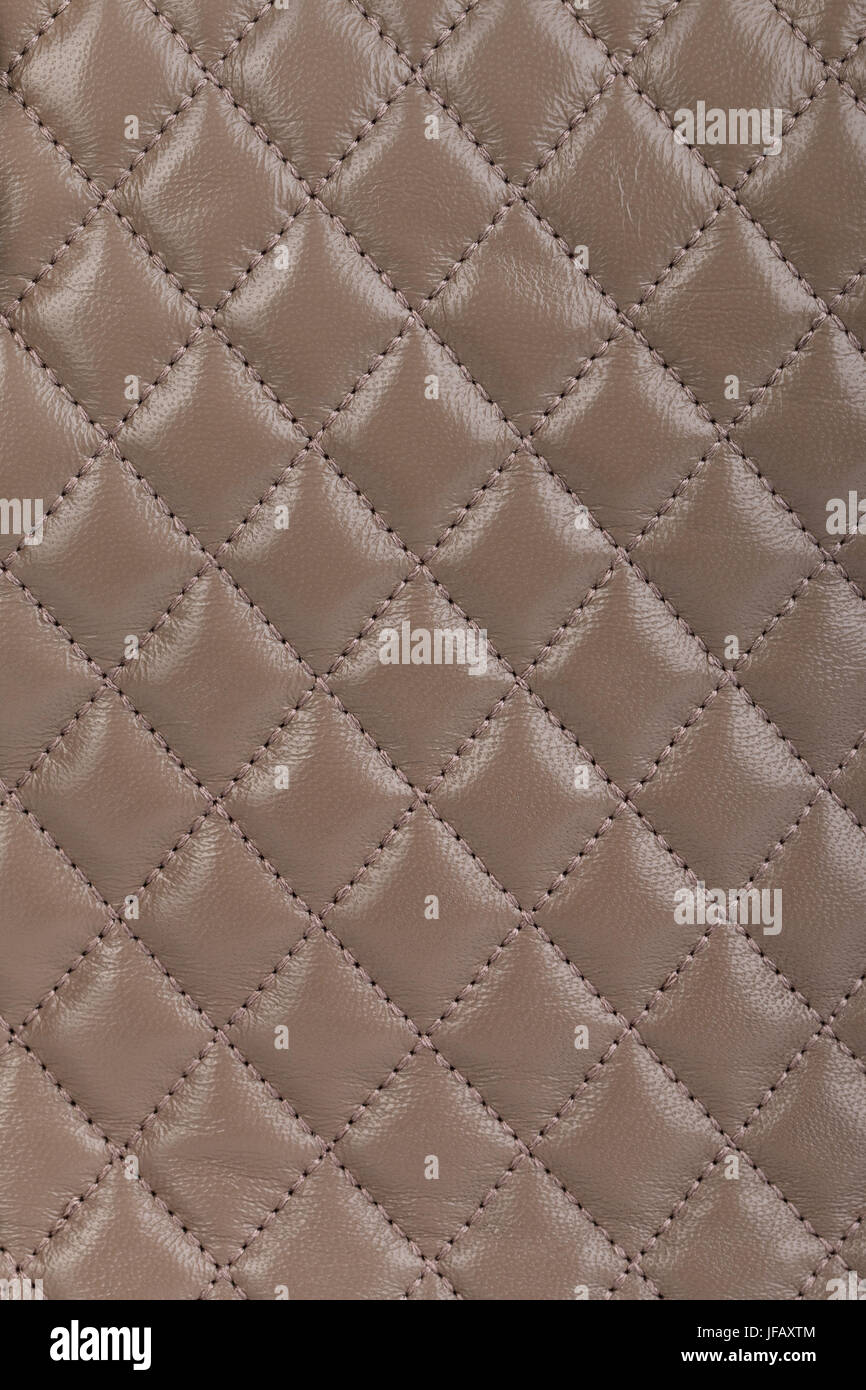 Beige quilted leather background Stock Photo