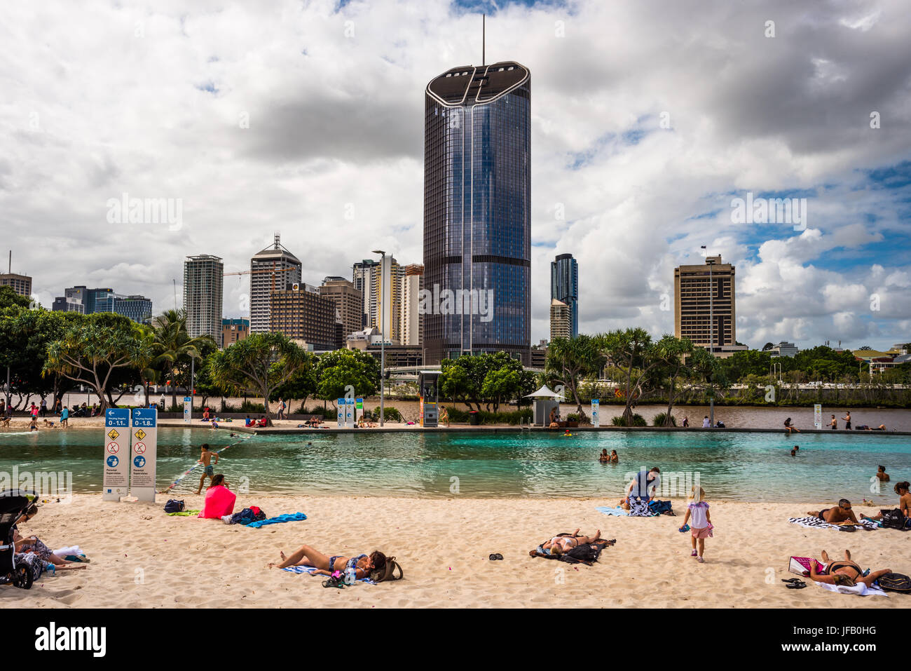 Streets Beach lagoon in the South Bank Parklands with city skyline in background. Brisbane, Queensland, Australia Stock Photo