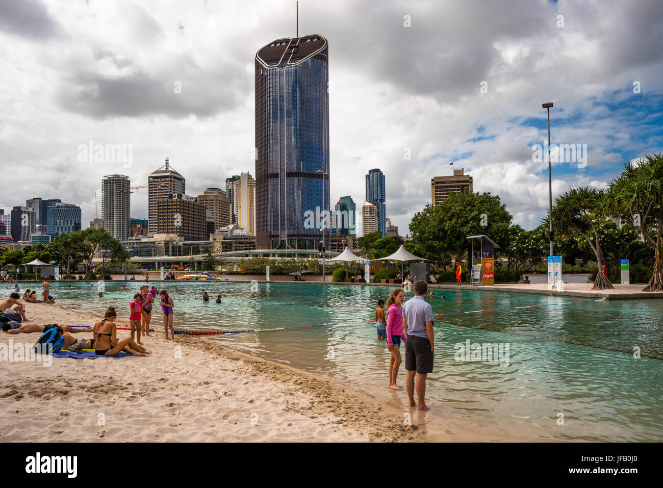 Streets Beach lagoon in the South Bank Parklands with city skyline in background. Brisbane, Queensland, Australia Stock Photo