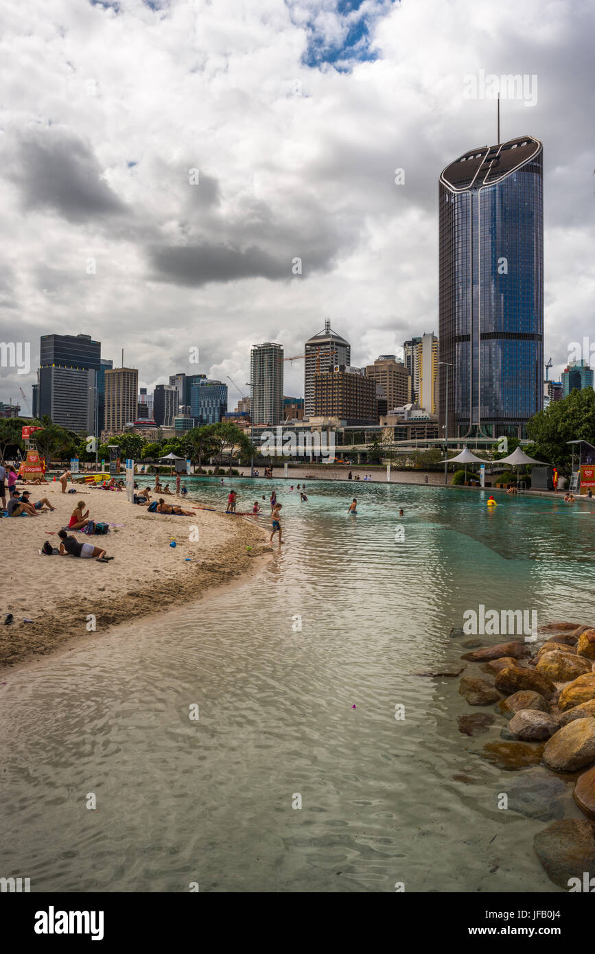 Streets Beach lagoon in the South Bank Parklands with city skyline in background. Brisbane, Queensland, Australia Stock Photo