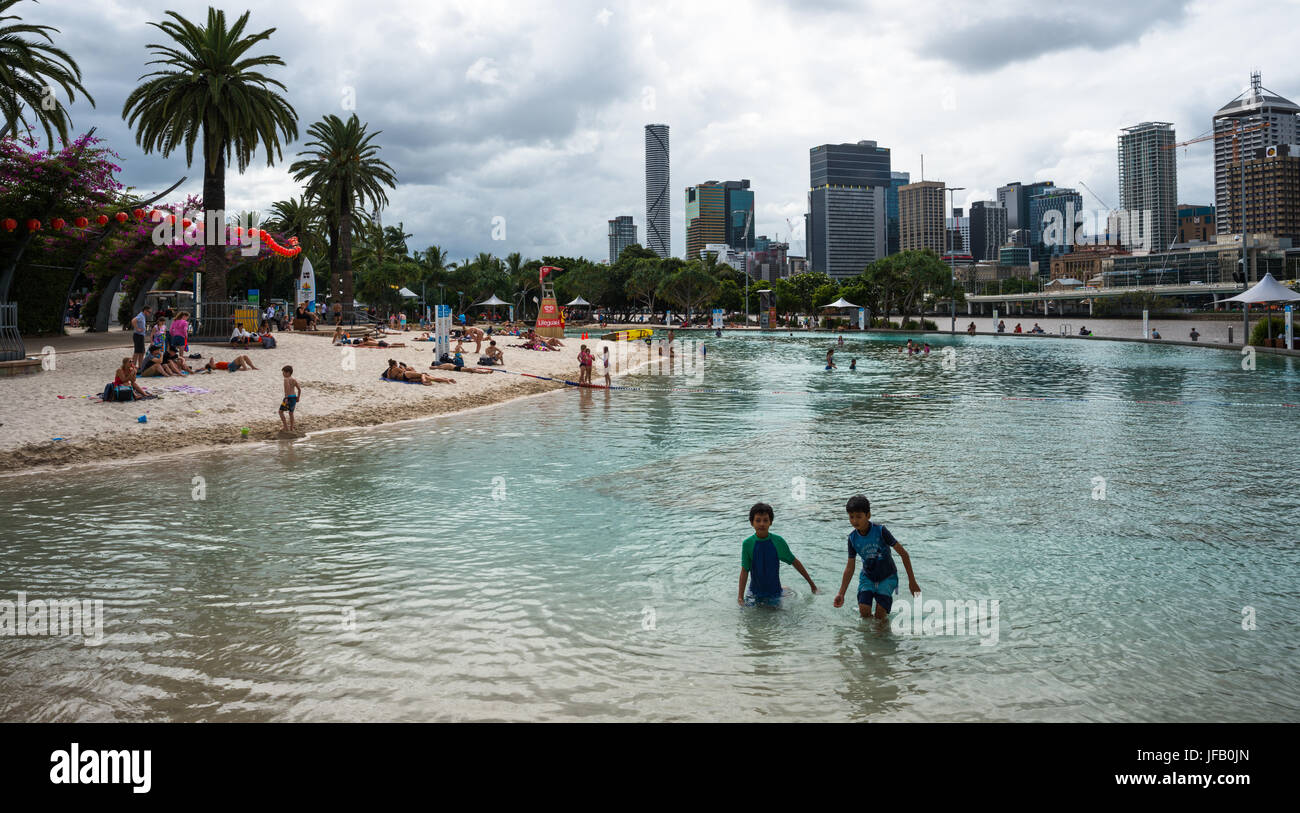 Streets Beach lagoon in the South Bank Parklands with city skyline in background. Brisbane, Queensland, Australia Stock Photo