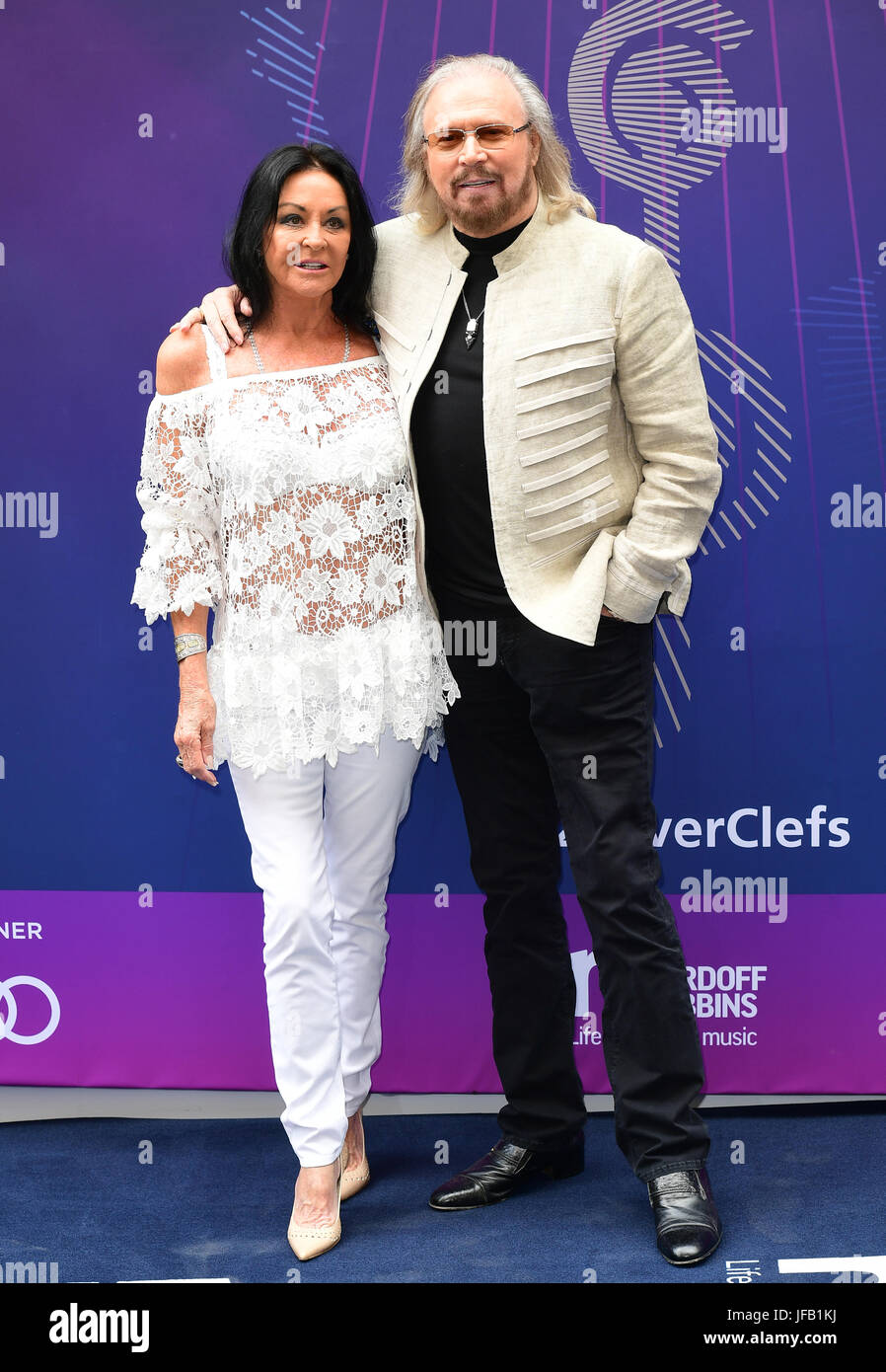 Linda Gibb and Barry Gibb attending the O2 Silver Clef Awards 2017, with the support of Nordoff Robbins, held at the Grosvenor House Hotel, London. Stock Photo