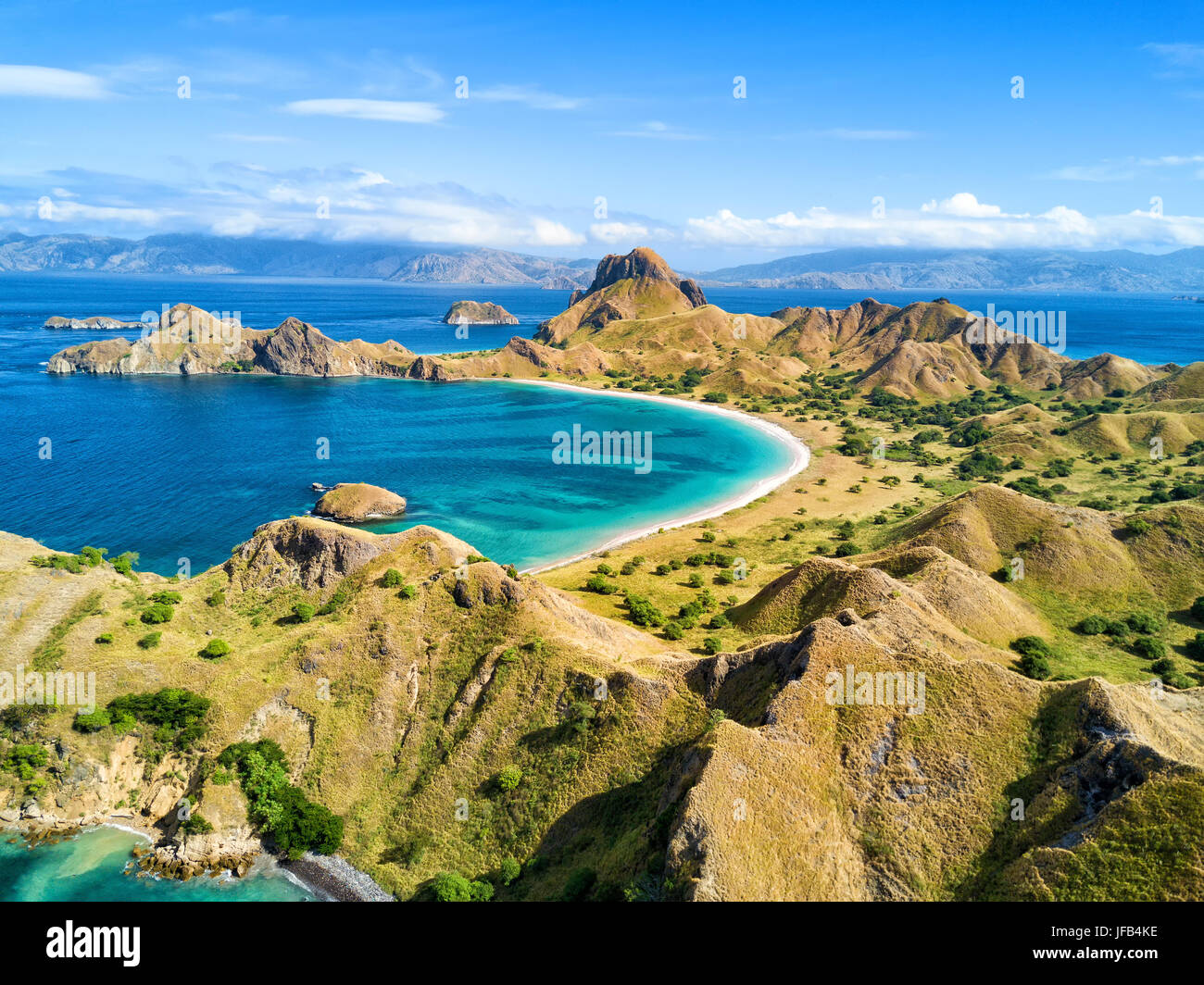 Aerial view of a small bay and hills on Pulau Padar island in between ...