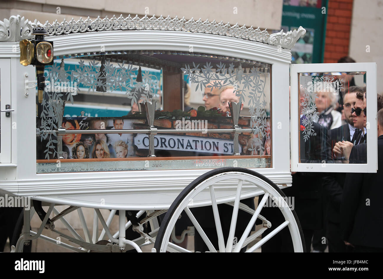 The coffin of Martyn Hett, who was killed in the Manchester Arena bombing, leaves Stockport Town Hall Plaza following his funeral service. Stock Photo