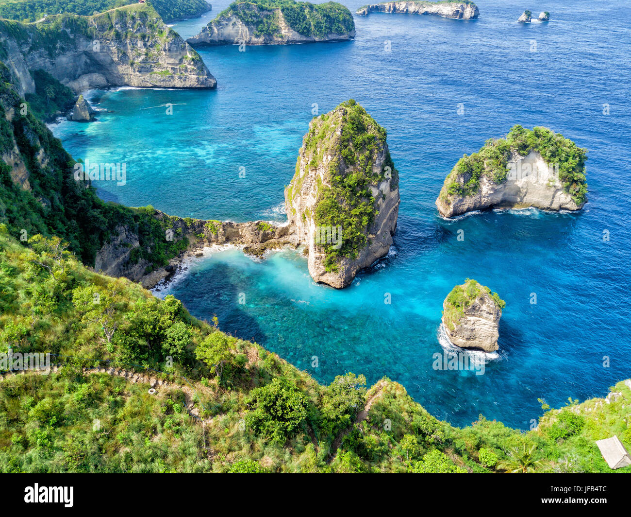 Aerial view of the small island of Nusa Batumategan from the Atuh Rija Lima shrine on Nusa Penida Island near Bali, Indonesia. Stock Photo