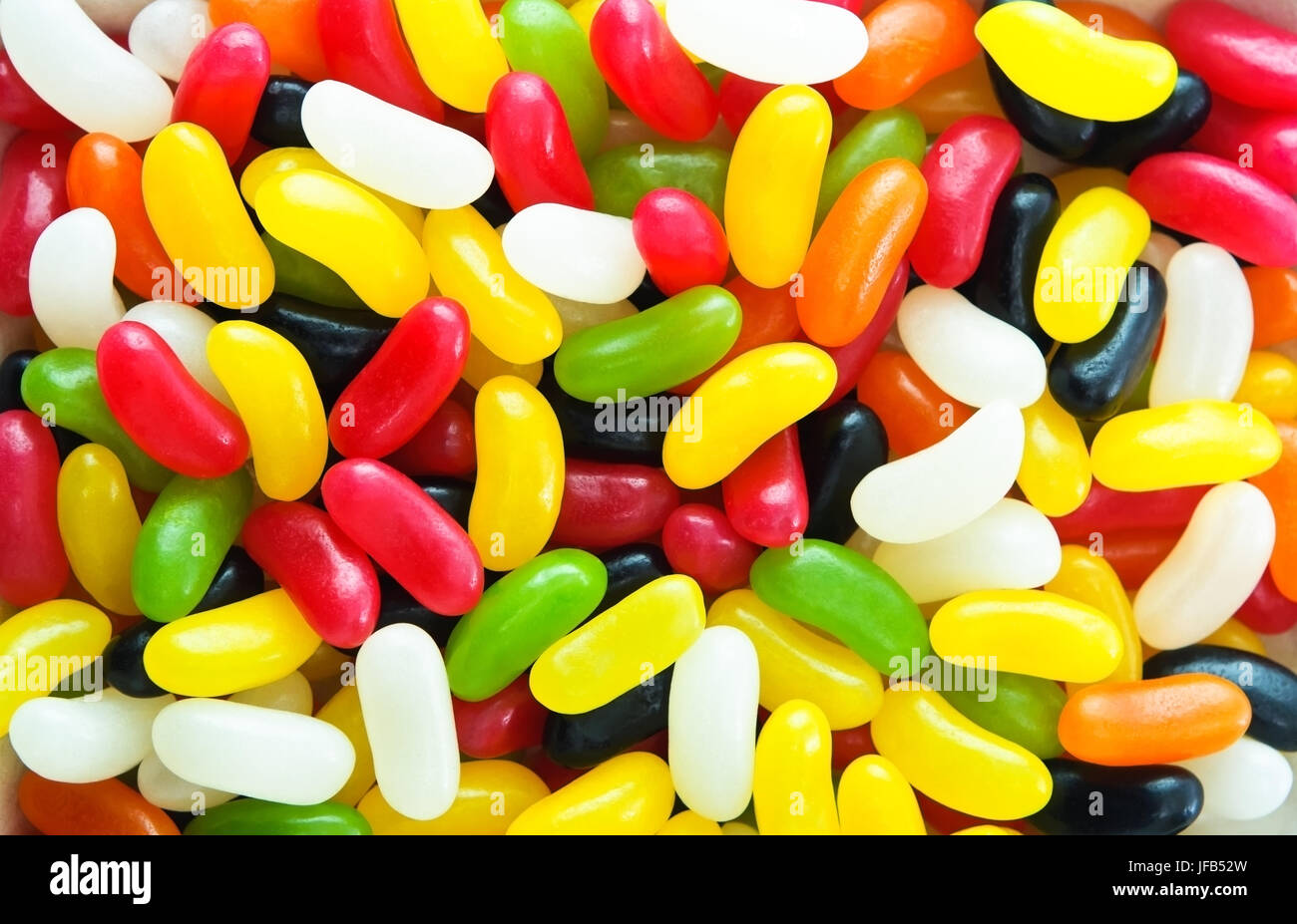 Bright, colourful filled frame background of gelatine-free jelly beans. Stock Photo