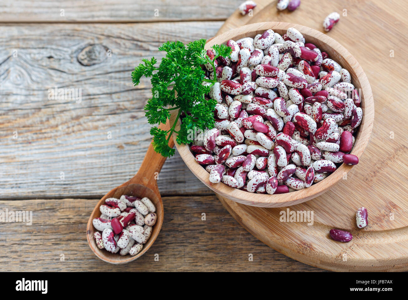 Speckled beans and parsley in a bowl. Stock Photo