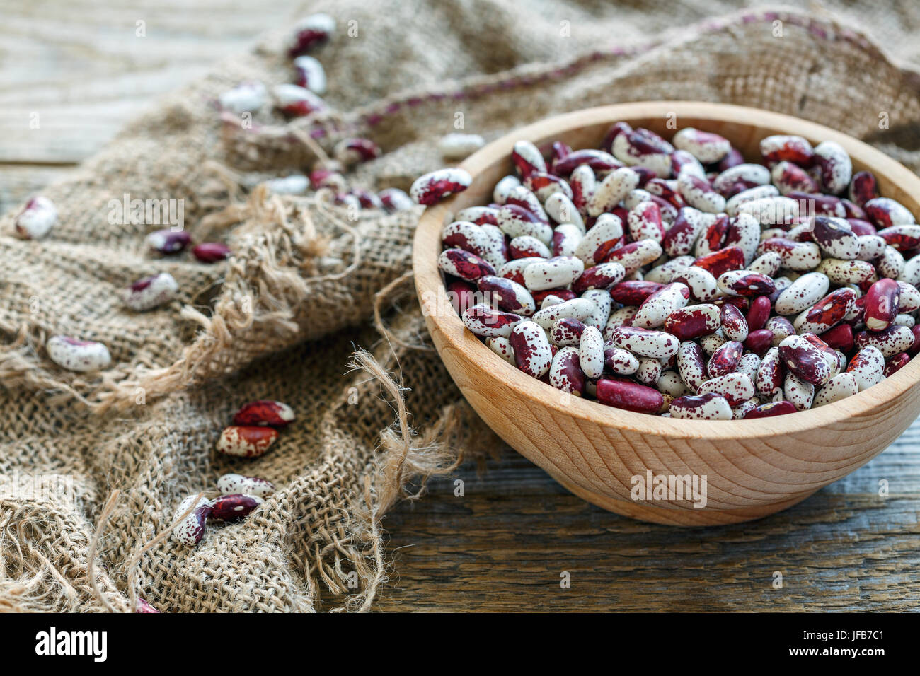 Speckled beans in a wooden bowl. Stock Photo