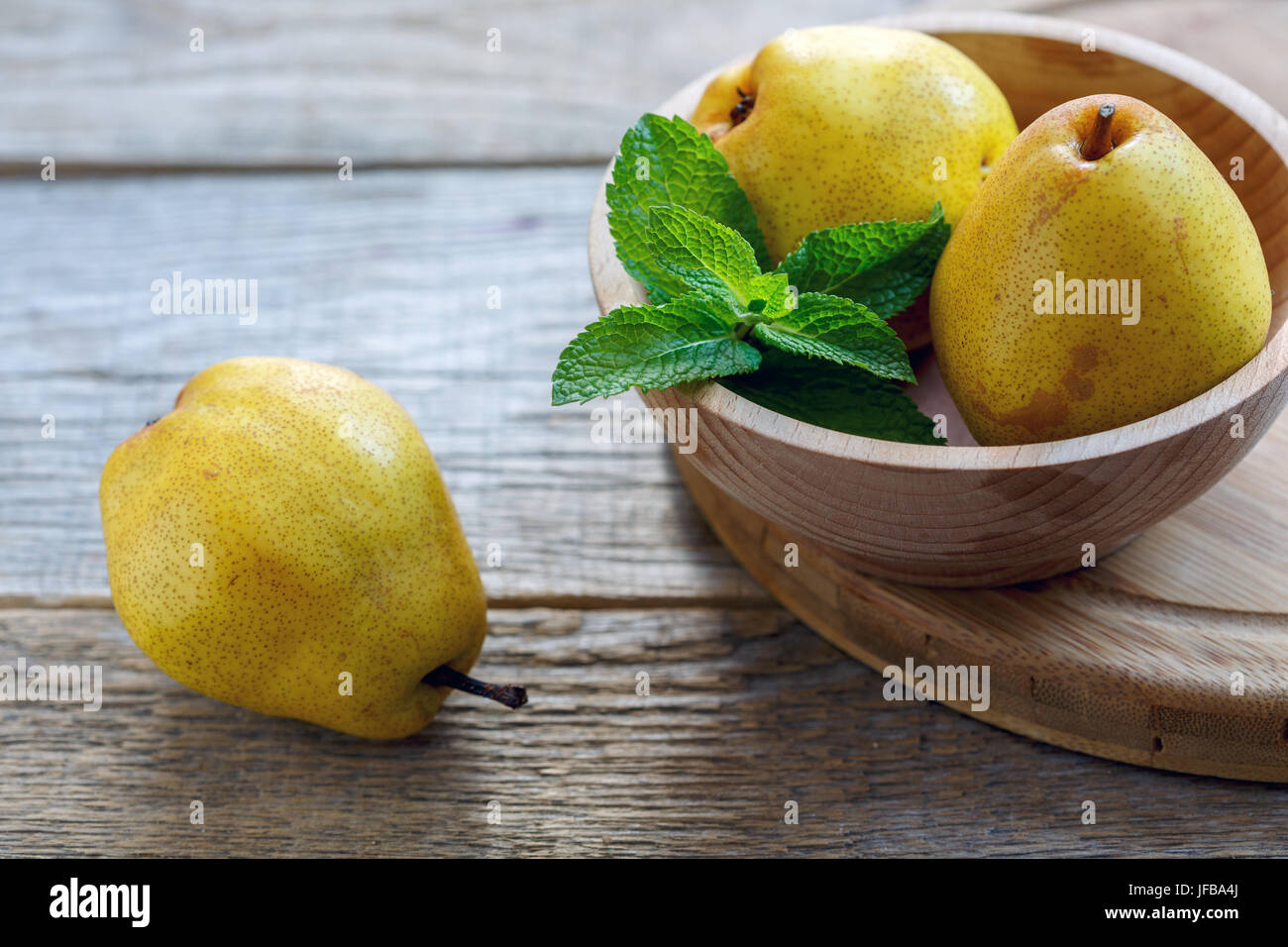 Yellow pear and mint. Stock Photo