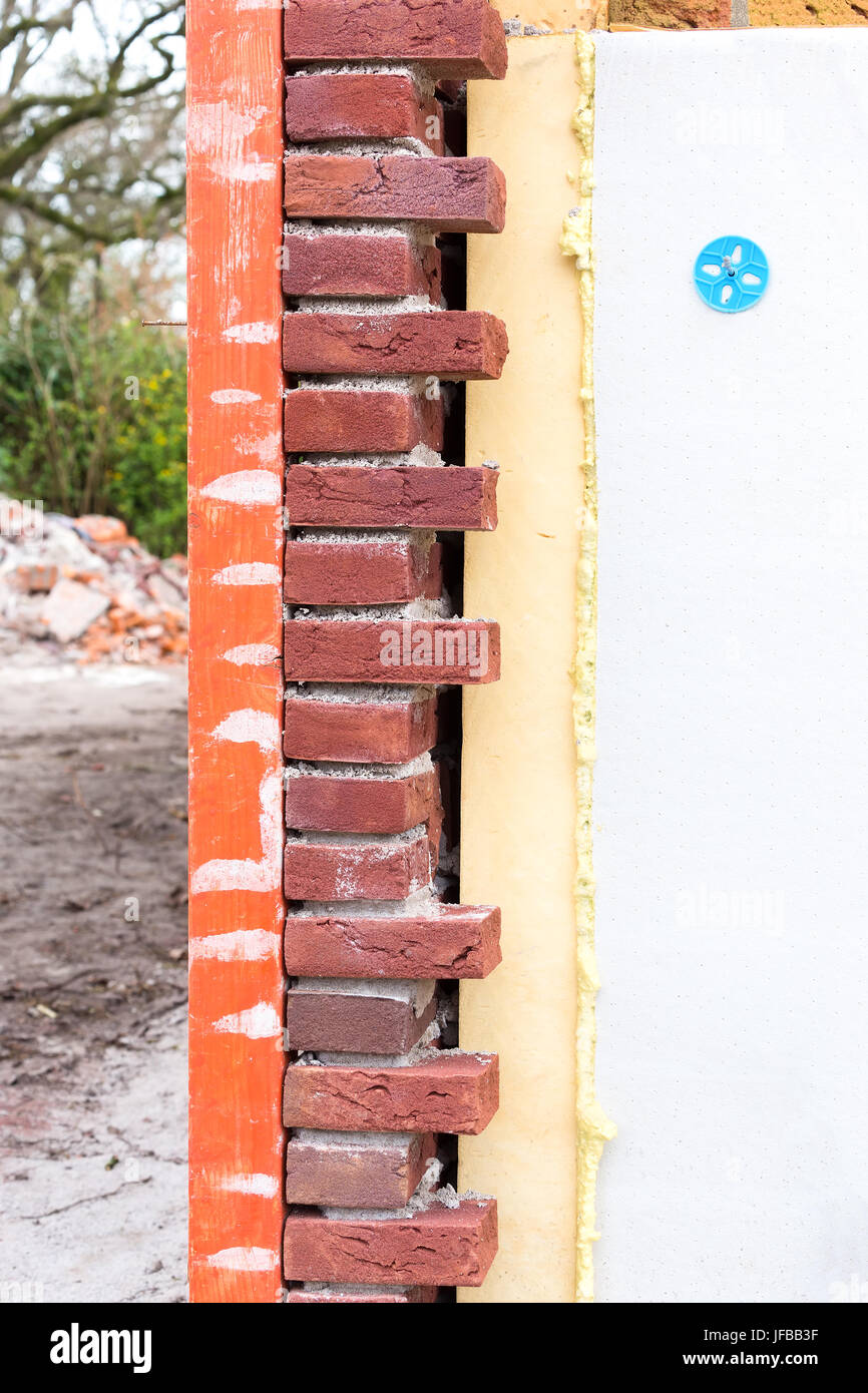 Masonry wall with cavity wall insulation Stock Photo