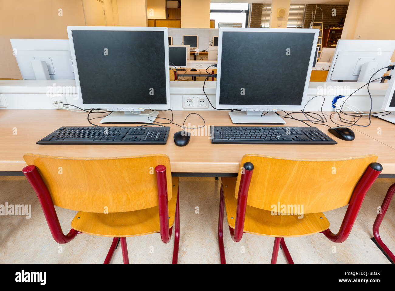 Two computers in classroom on high school Stock Photo