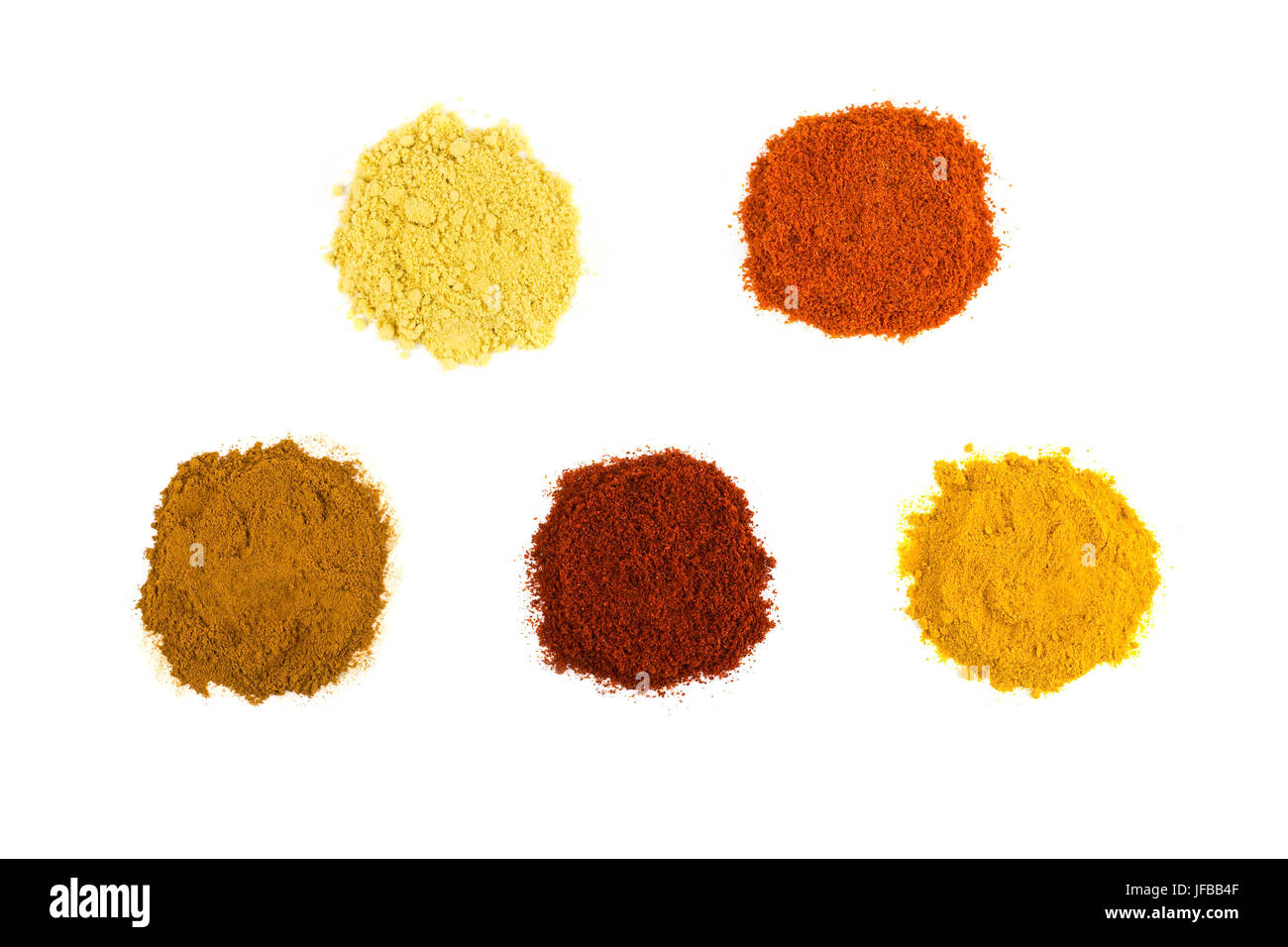 Heaps of various seasoning spices on white Stock Photo
