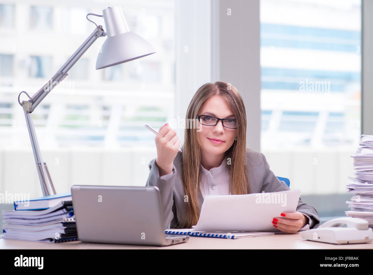 Businesswoman working in the office Stock Photo - Alamy