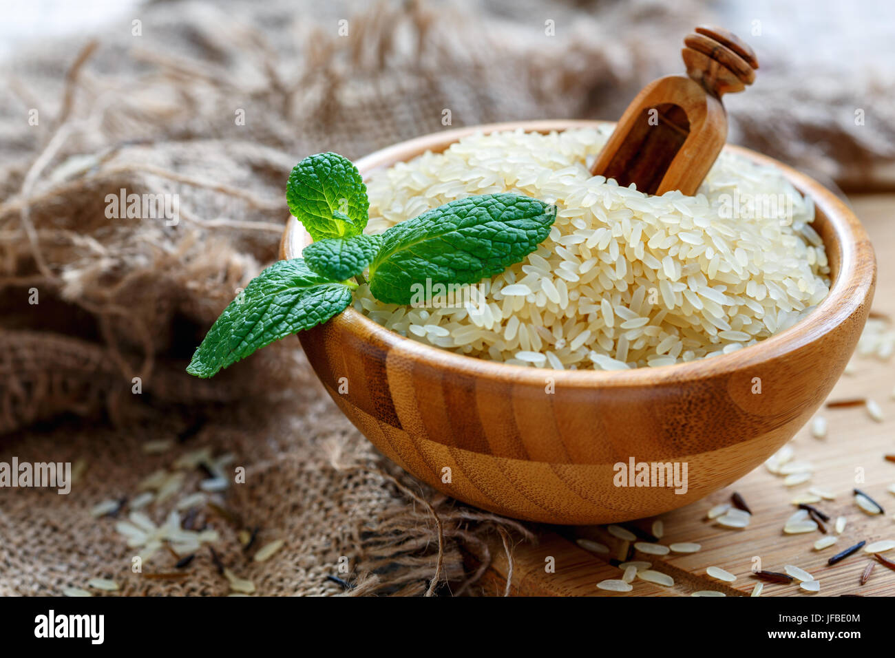Bowl with long grain rice and fresh mint. Stock Photo