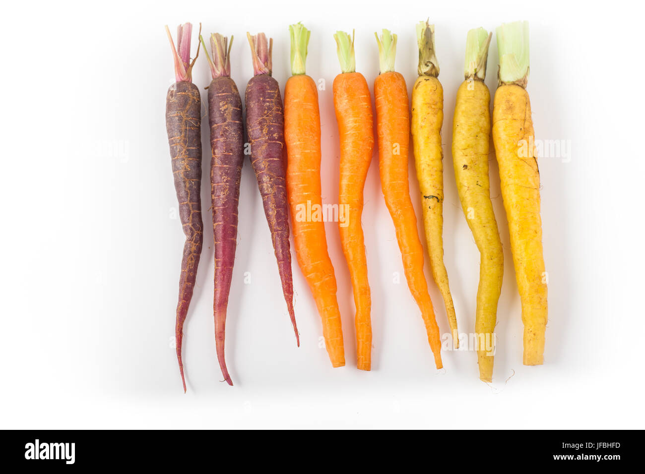 Baby Rainbow Carrots on White Background Stock Photo Alamy