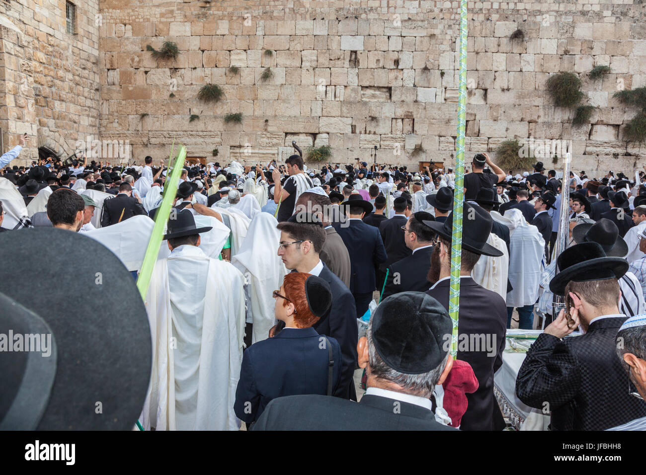 Jewish worshipers in white shawls Stock Photo