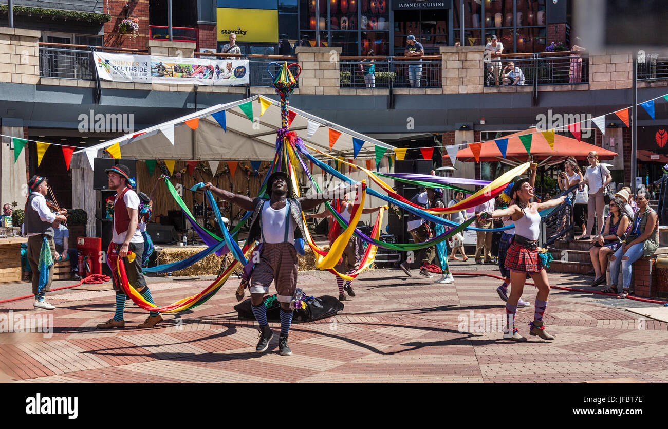 Folk Dance Remixed, a troupe fusing maypole and clog dancing with Hip Hop. Performing at The Arcadian - Summer in Southside Festival in central Birmin Stock Photo