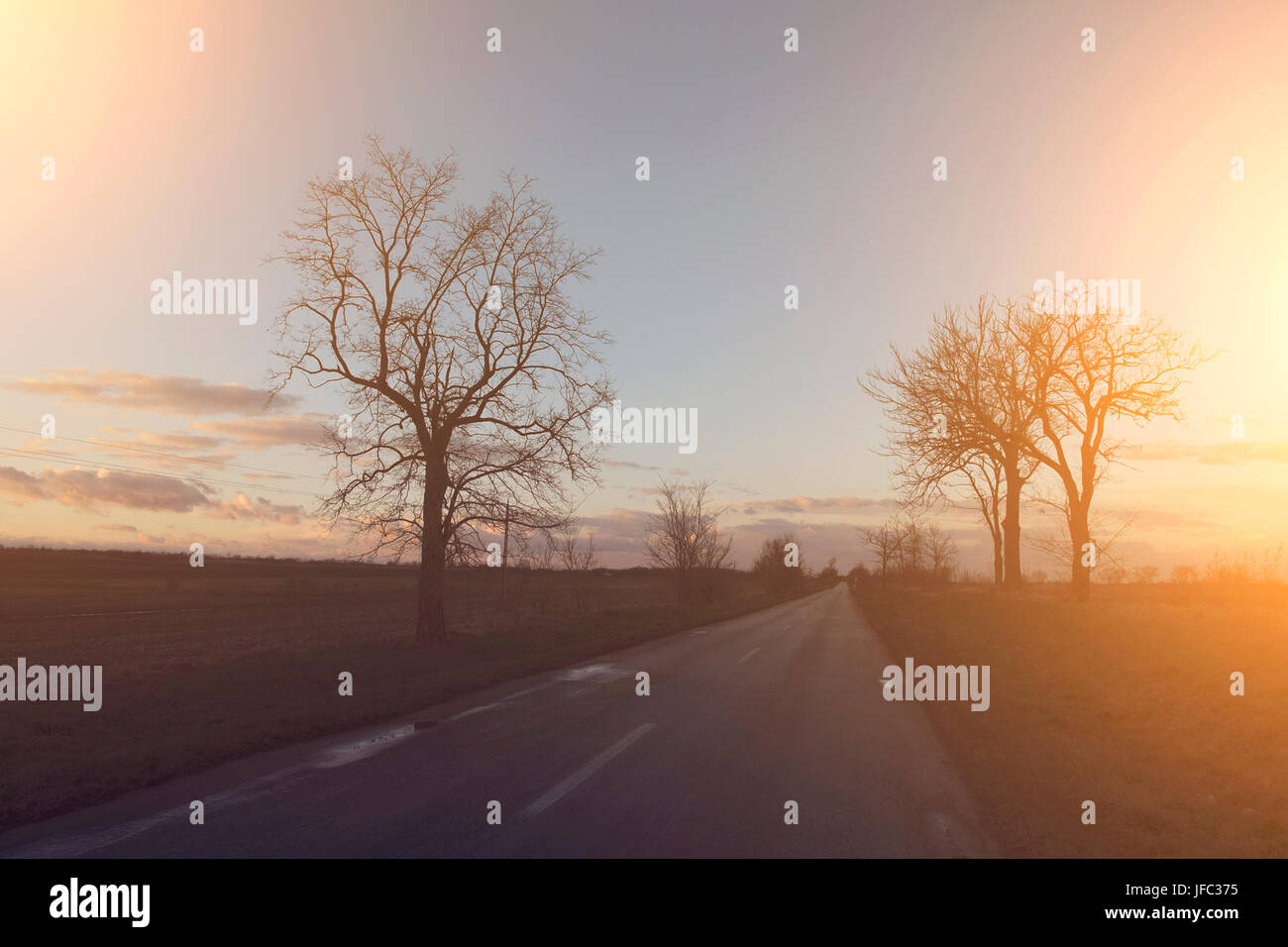 Asphalt road and sky Stock Photo - Alamy