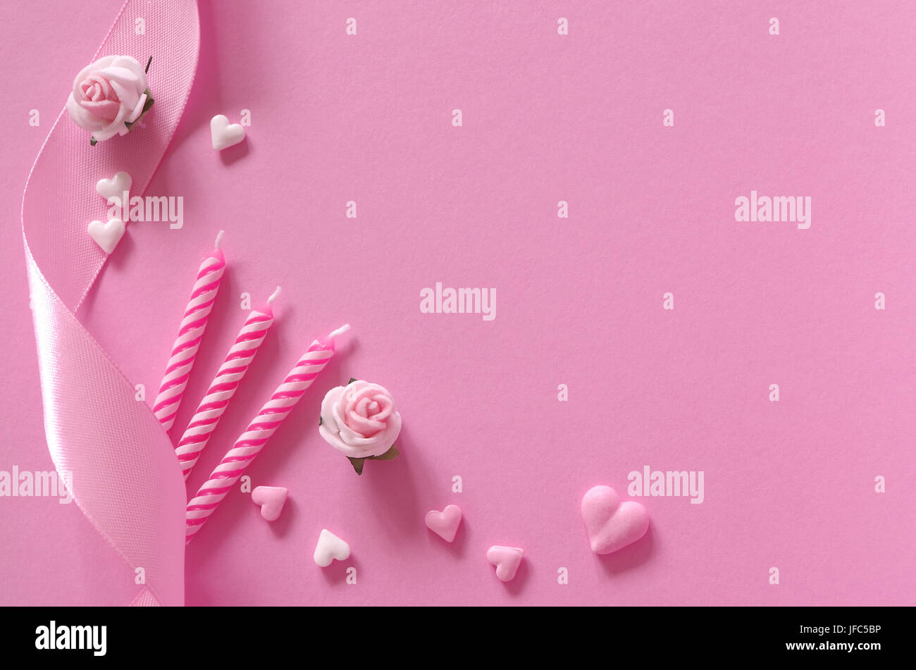 hearts, roses, birthday candles and ribbon Stock Photo Alamy