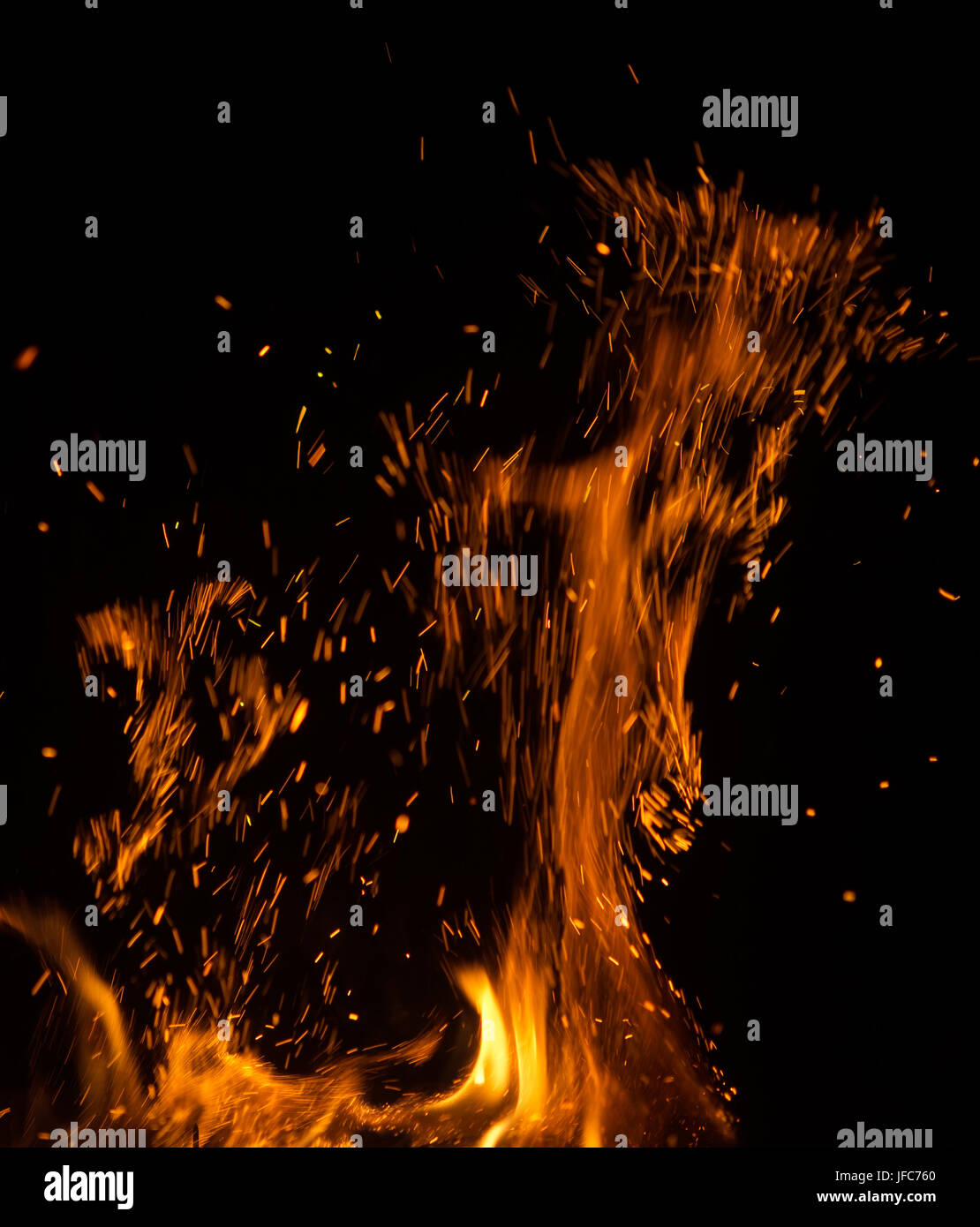 fire flames with sparks on black background Stock Photo - Alamy