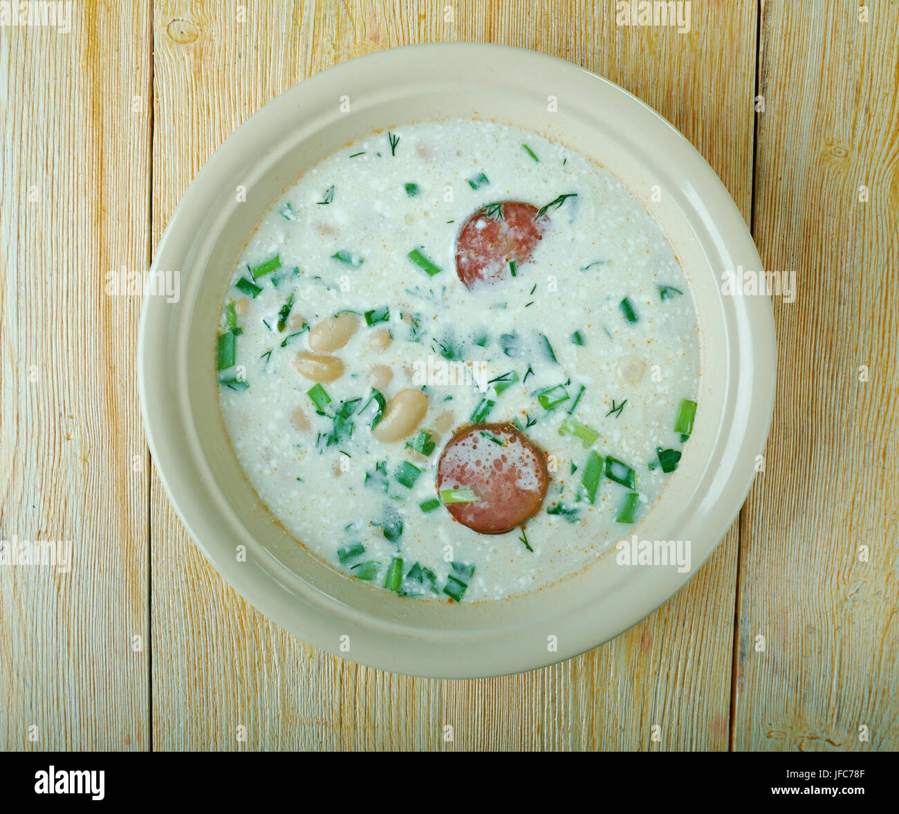 Soup with beans, sour cream and sausage Stock Photo