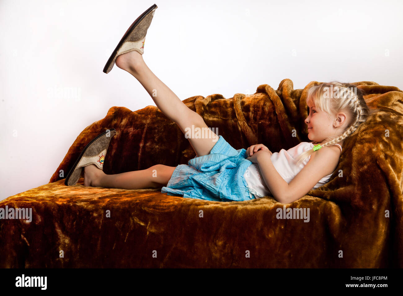 Little Girl And Big Shoes Stock Photo