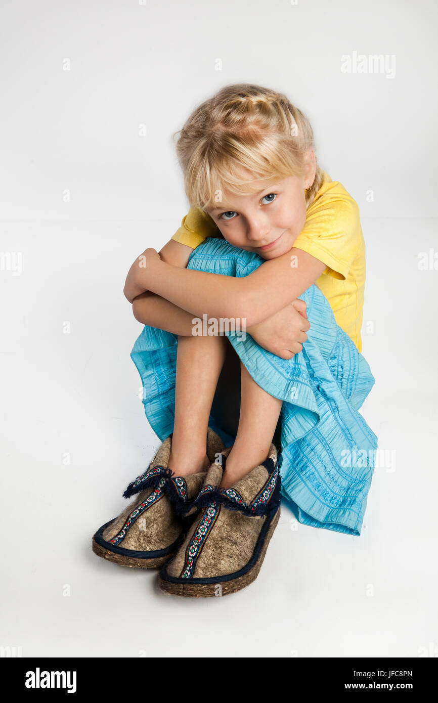 Pretty Little Girl In Big Shoes Stock Photo