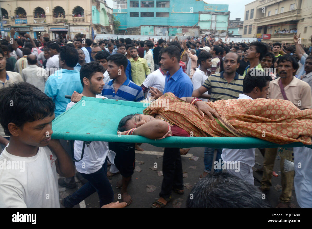 Volunteers Carry Fainted Woman During Ratha Yatra Or Car Festival In Puri Krishna Devotees From 