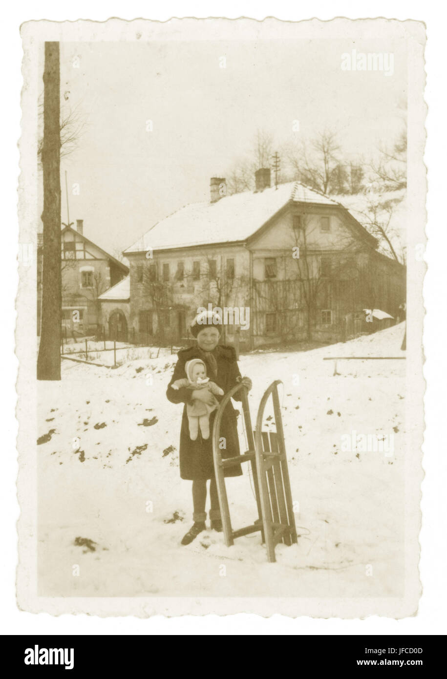 Young girl with sledge, Hochburg, Austria, 29 Dec. 1940. Stock Photo