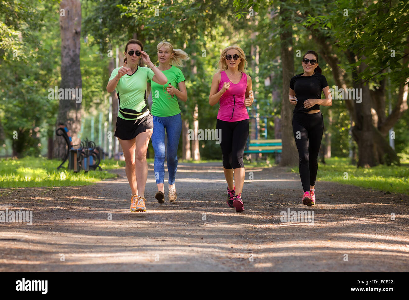 https://c8.alamy.com/comp/JFCE22/women-running-in-park-JFCE22.jpg