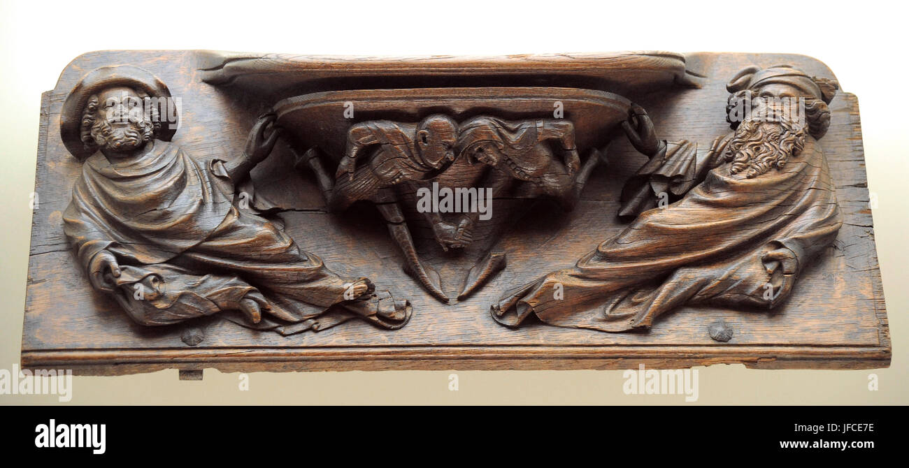 Pere Sanglada (documented between 1386-1408). Spanish artist. Misericord depicting two men testing strength, 1394-1399. Oak wood. From the seating in the choir of the Barcelona Cathedral. National Art Museum of Catalonia. Barcelona. Catalonia. Spain. Stock Photo