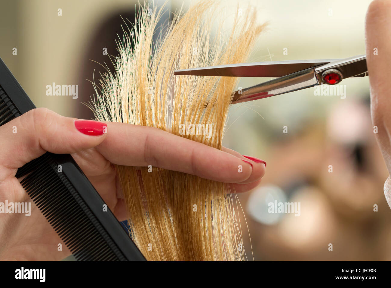 Close Up View Of Female Hairdresser Hands Cutting Hair Tips