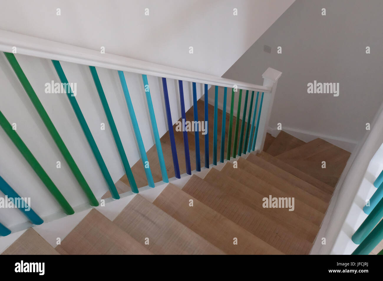 Wooden Staircase With Balustrade Painted In Ombre Effect Stock