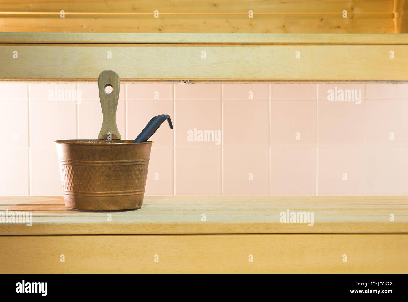 Traditional and authentic Finnish city sauna. Wooden bench and tiles in the wall in Finland. Also suitable for background template and design. Stock Photo