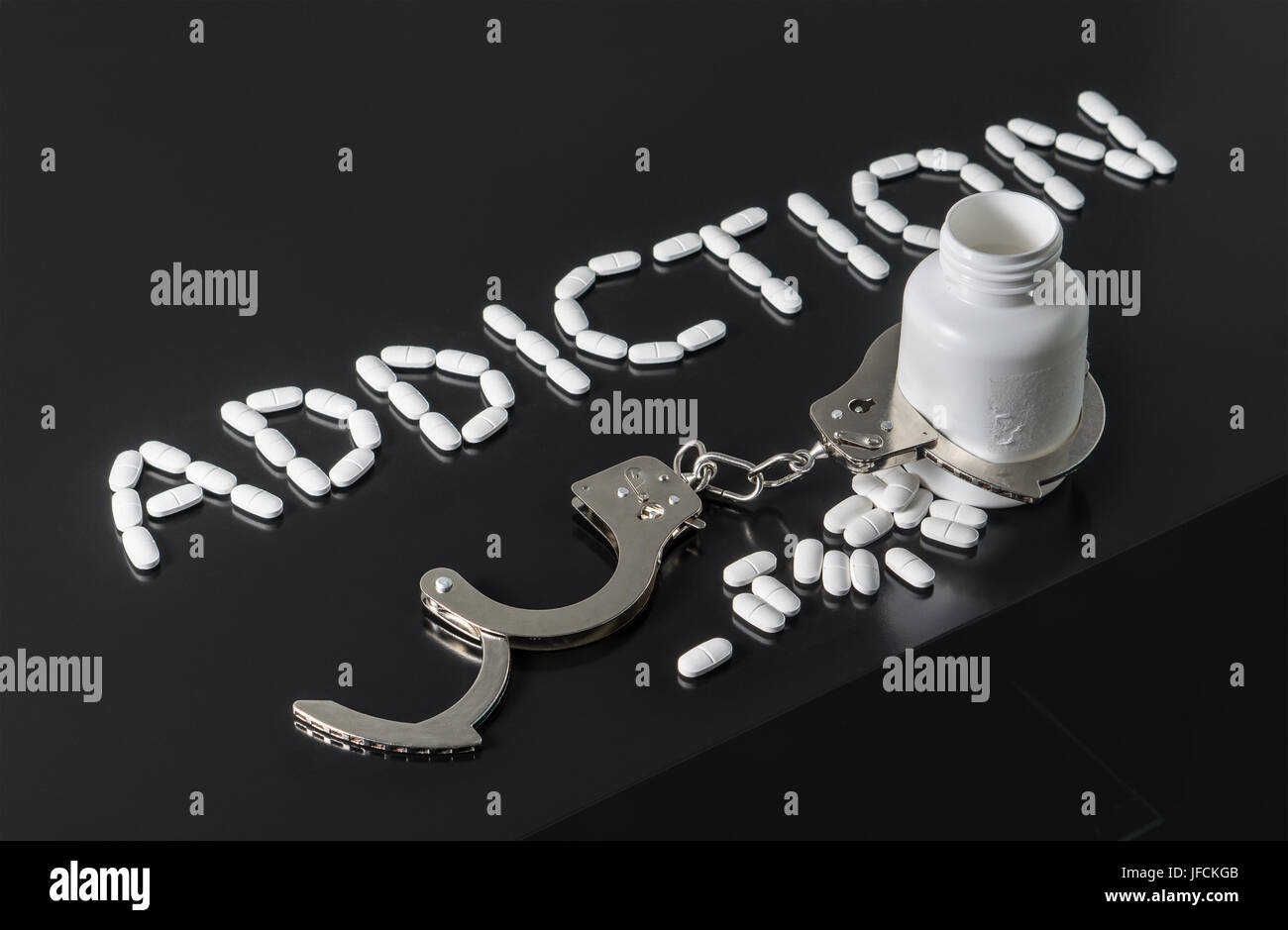 Get addicted to drugs or free from addiction to medicine. Drug and narcotics abuse or after rehab concept. Addiction written with pills. Medicine. Stock Photo