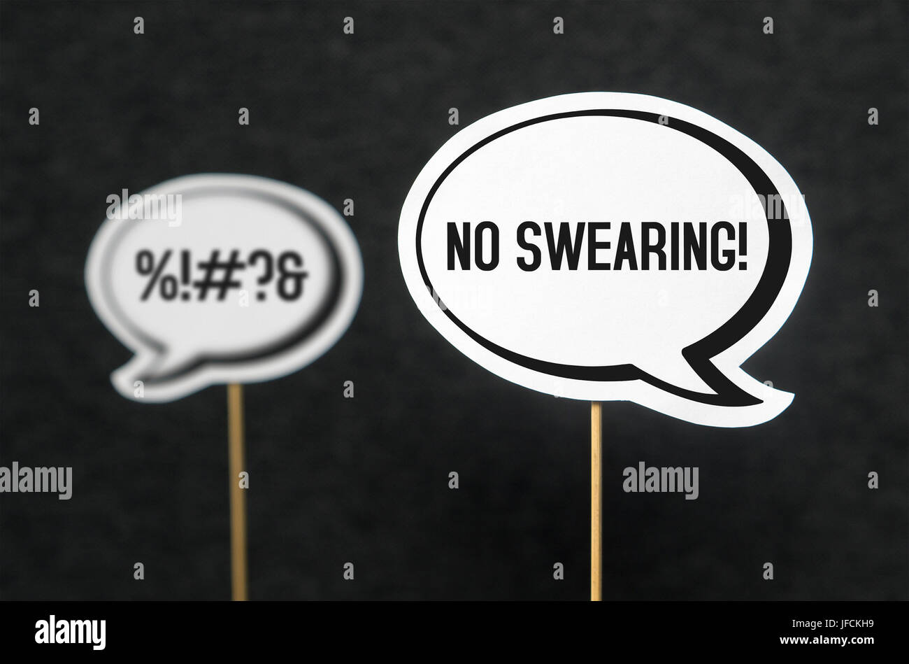 Swearing, cursing and bad language or behaviour in school, work or life. Speech bubble telling the other not to swear. Concept of no dirty words. Stock Photo