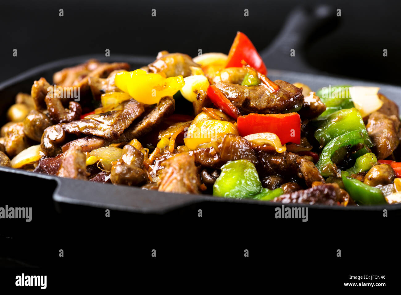 food in iron cast skillet Stock Photo