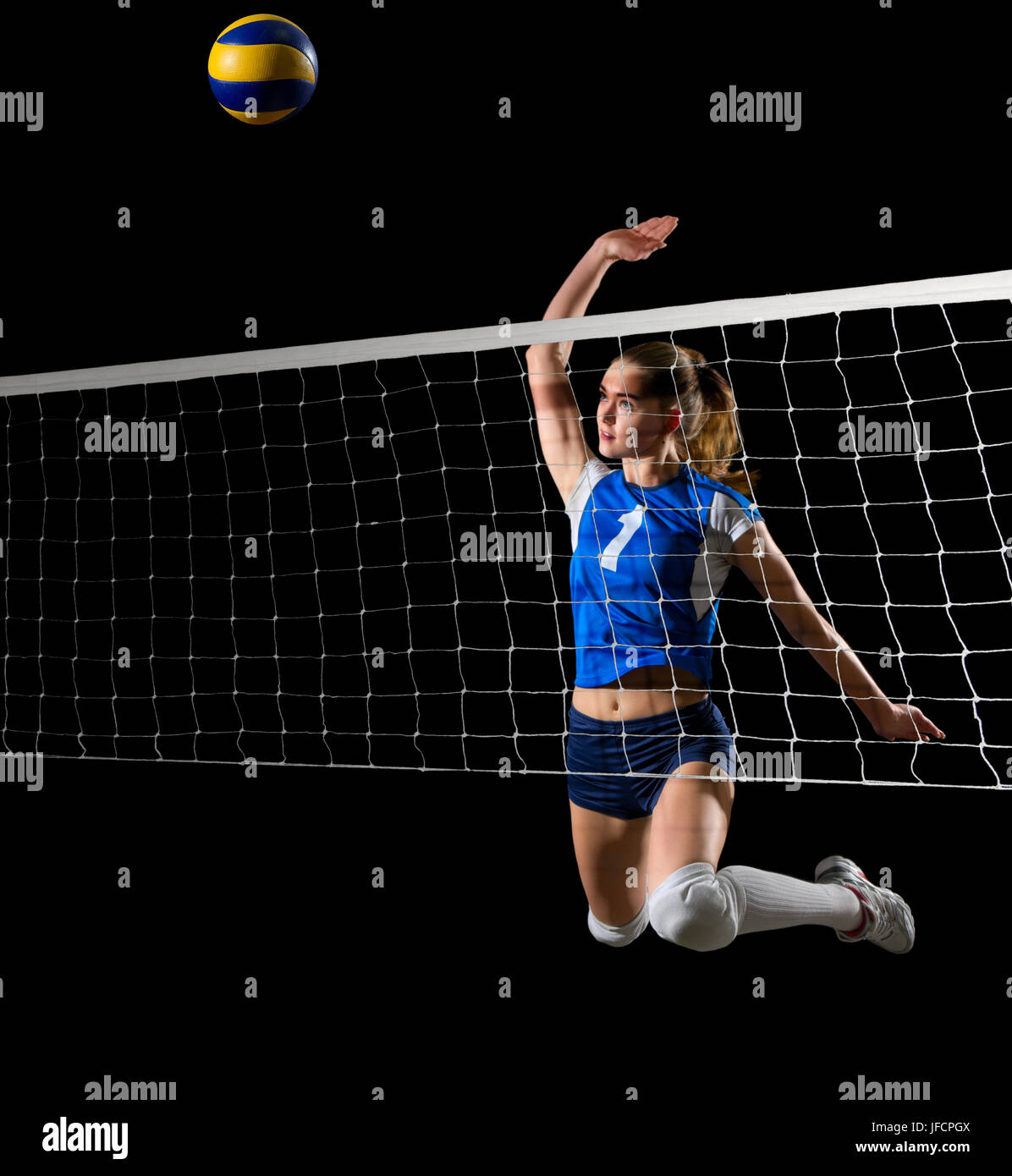 Young girl volleyball player isolated Stock Photo - Alamy