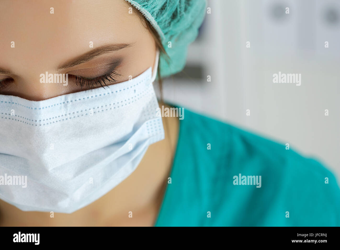Female doctor wearing green scrubs hi-res stock photography and images ...