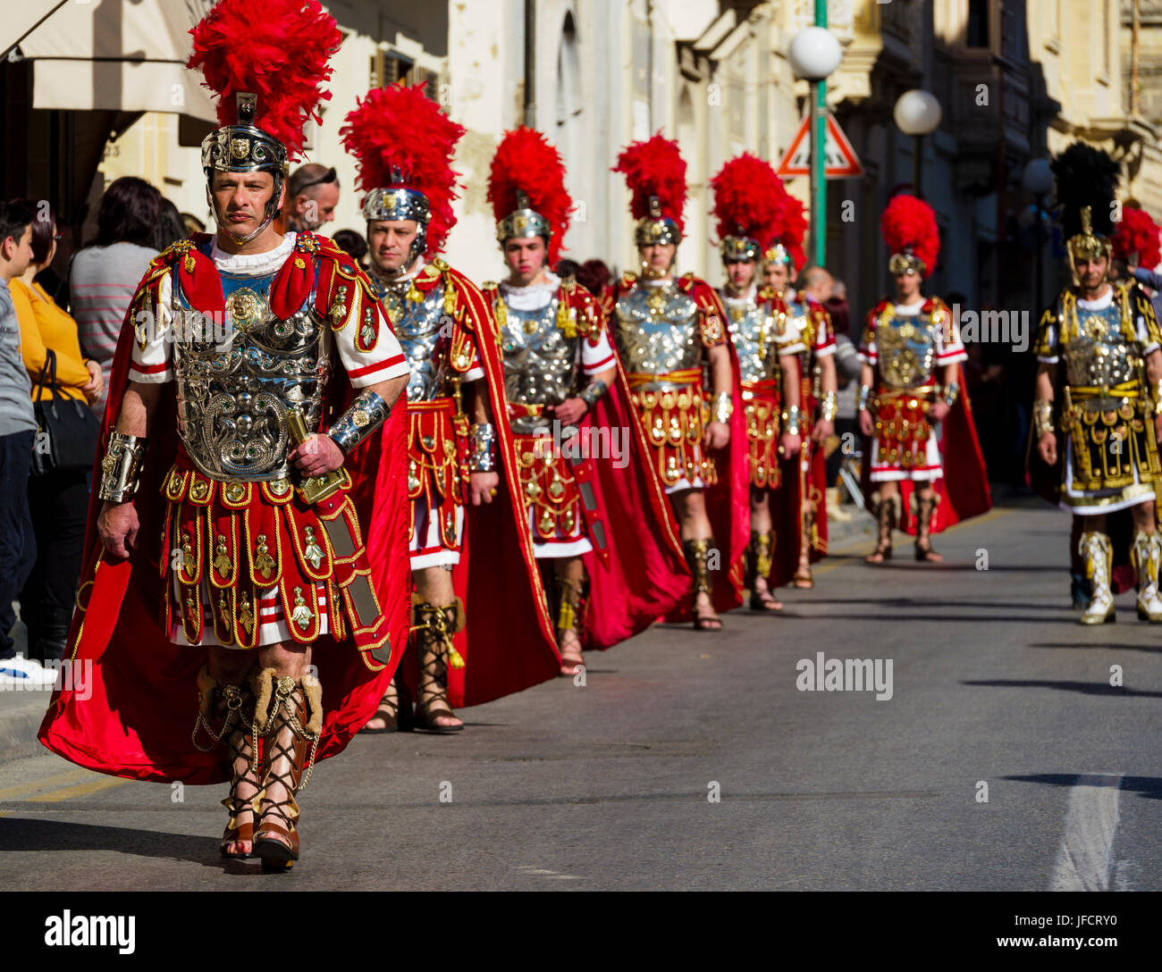 Inhabitants of Zejtun / Malta had their traditional Good Friday procession in front of their church, some of them dressed like Roman legionaries Stock Photo