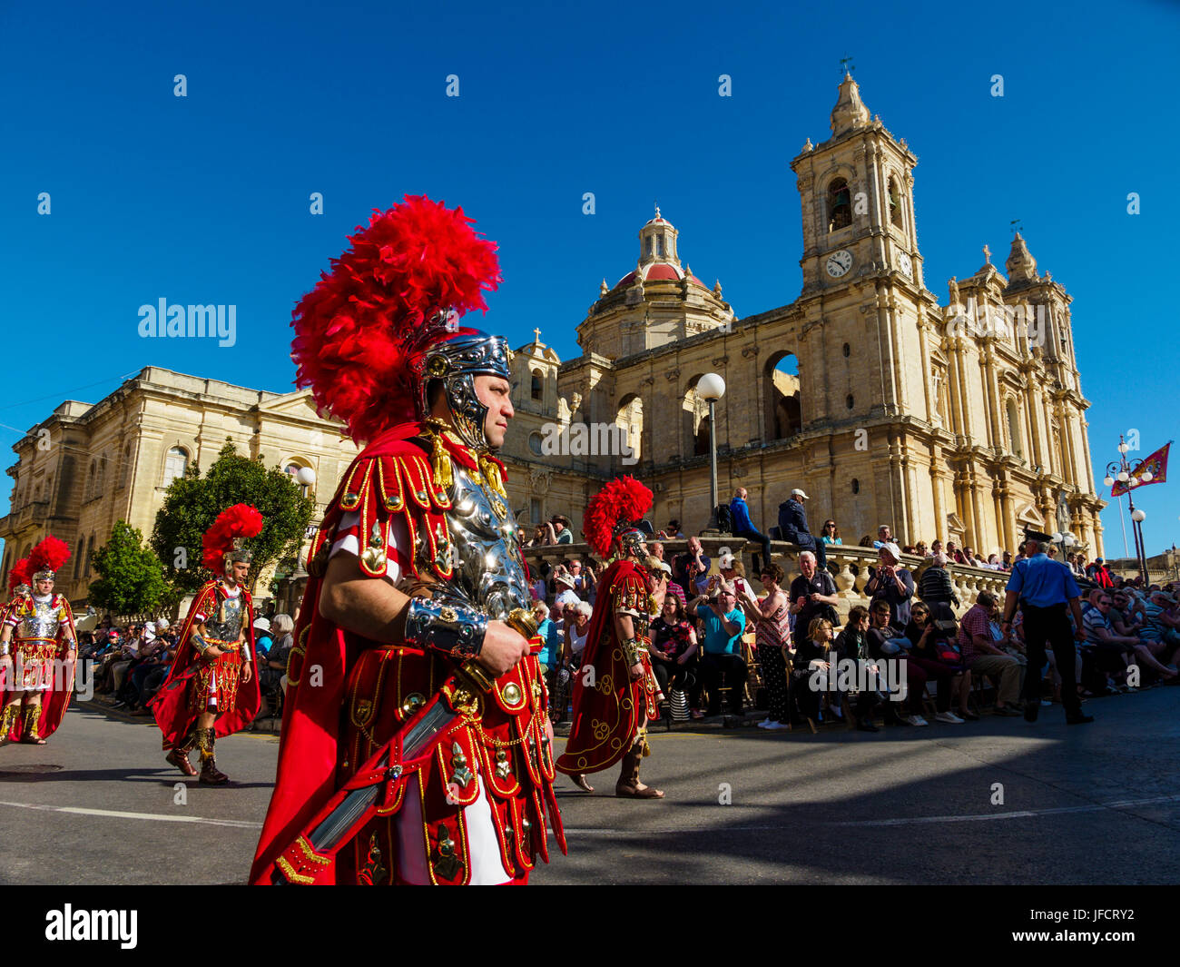 Inhabitants of Zejtun / Malta had their traditional Good Friday procession in front of their church, some of them dressed like Roman legionaries Stock Photo